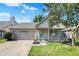 Charming single-story home boasts an attached garage, covered front porch, and well-maintained lawn at 9936 Waterside Dr, Noblesville, IN 46060