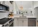 Modern kitchen features stainless steel appliances, quartz countertops, and ample natural light at 9936 Waterside Dr, Noblesville, IN 46060