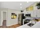 Modern kitchen features stainless steel appliances, quartz countertops, and plenty of storage at 9936 Waterside Dr, Noblesville, IN 46060