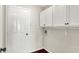 Convenient laundry room featuring built-in cabinets for storage and easy access to utilities at 9936 Waterside Dr, Noblesville, IN 46060
