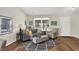 Inviting living room featuring modern furnishings, a neutral color palette, and wood flooring at 9936 Waterside Dr, Noblesville, IN 46060