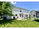 Lush backyard featuring a patio, dining area, storage shed, and trampoline, perfect for relaxing at 10539 Ross Xing, Fishers, IN 46038
