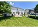 Lush backyard featuring a patio, dining area, shed, and trampoline, perfect for outdoor entertaining at 10539 Ross Xing, Fishers, IN 46038