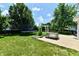 Spacious backyard featuring a trampoline, playground, concrete patio and a beautiful lawn at 10539 Ross Xing, Fishers, IN 46038