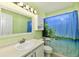 Bathroom with a decorative mirror, decorative shower curtain and a light-colored accent wall at 10539 Ross Xing, Fishers, IN 46038