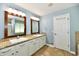 Bright bathroom with double vanity, granite countertop, tile floor and wood framed mirrors at 10539 Ross Xing, Fishers, IN 46038