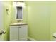 Bathroom featuring a vanity with new hardware, decorative mirror, and neutral countertop at 10539 Ross Xing, Fishers, IN 46038