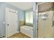 Well lit bathroom featuring a bathtub and glass door shower at 10539 Ross Xing, Fishers, IN 46038