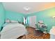 Bedroom with aqua colored walls, wood floors and bed with decorative pillows at 10539 Ross Xing, Fishers, IN 46038