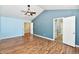 Spacious bedroom featuring wood floors, blue accent wall and ceiling fan at 10539 Ross Xing, Fishers, IN 46038