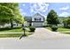 Charming two-story home with a well-manicured lawn and mature trees at 10539 Ross Xing, Fishers, IN 46038