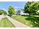 A charming two-story home with a well-manicured lawn and mature trees at 10539 Ross Xing, Fishers, IN 46038