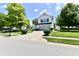 Charming two-story home with a well-manicured lawn and mature trees at 10539 Ross Xing, Fishers, IN 46038