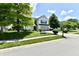 Charming two-story home with a well-manicured lawn and mature trees at 10539 Ross Xing, Fishers, IN 46038