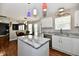 Open kitchen with granite countertops, stainless steel dishwasher, and eat in dining area at 10539 Ross Xing, Fishers, IN 46038