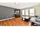 Living room with hardwood floors, tv, modern furniture and lots of natural light at 10539 Ross Xing, Fishers, IN 46038