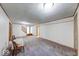 Open basement with neutral carpet, white walls, and doors leading to other areas of the home at 11 N Restin Rd, Greenwood, IN 46142