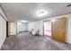 Spacious basement featuring neutral carpet, white walls, and two doorways leading to other areas of the home at 11 N Restin Rd, Greenwood, IN 46142