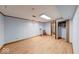 Basement featuring light wood floors, light blue walls, a closet, and doorways to other rooms at 11 N Restin Rd, Greenwood, IN 46142