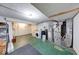 An unfinished basement includes a washer, dryer, and mechanicals, providing space for utilities and storage at 11 N Restin Rd, Greenwood, IN 46142