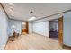 Large basement with wood floors, white walls, and doorways leading to a bathroom and another room at 11 N Restin Rd, Greenwood, IN 46142