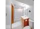 Bathroom with a white shower stall and a wood vanity with a white sink, along with a toilet and mirror at 11 N Restin Rd, Greenwood, IN 46142