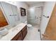 Bathroom featuring a vanity, shower, tile floors, and mirrored cabinet at 11 N Restin Rd, Greenwood, IN 46142