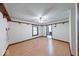 Large bedroom with wood-look flooring, window, and bathroom access at 11 N Restin Rd, Greenwood, IN 46142