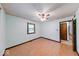 Bright bedroom features wood-look flooring, a ceiling fan, and a window at 11 N Restin Rd, Greenwood, IN 46142