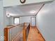 Bright foyer with wood floors, stairs, and view into the carpeted living area at 11 N Restin Rd, Greenwood, IN 46142