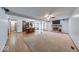 Open living space with hardwood floors, carpet, a fireplace, and bar seating by the kitchen at 11 N Restin Rd, Greenwood, IN 46142