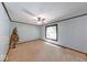 Spacious living room with neutral carpet, ceiling fan, and large window at 11 N Restin Rd, Greenwood, IN 46142