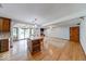 Open floor plan with a central island, hardwood flooring, and views of the living room fireplace at 11 N Restin Rd, Greenwood, IN 46142