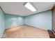 A bright room with light blue walls and wood-look flooring creates a fresh and inviting atmosphere at 11 N Restin Rd, Greenwood, IN 46142