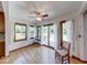 Sun room featuring many large windows, neutral decor and hardwood floors at 11 N Restin Rd, Greenwood, IN 46142