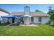 Well-maintained backyard with a patio, lush lawn, and a privacy fence at 1112 Berwyn Rd, Whiteland, IN 46184