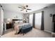 Bright bedroom with ceiling fan, neutral decor, and large windows at 1112 Berwyn Rd, Whiteland, IN 46184
