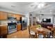 Well-equipped kitchen with stainless steel appliances and adjacent dining area at 1112 Berwyn Rd, Whiteland, IN 46184
