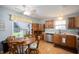 Charming kitchen and dining area with garden view from large sliding doors to back yard at 1112 Berwyn Rd, Whiteland, IN 46184