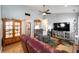 Spacious living room featuring hardwood floors, comfortable seating, and natural light at 1112 Berwyn Rd, Whiteland, IN 46184