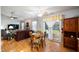 Open-concept living space with dining area, comfortable seating, and sliding glass door to backyard at 1112 Berwyn Rd, Whiteland, IN 46184