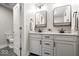 Bathroom with double sink vanity and white cabinets offering storage space at 12674 Banbury Cir, Carmel, IN 46033