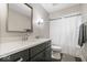 Clean and modern bathroom with quartz countertop, vanity, shower curtain, and neutral color palette at 12674 Banbury Cir, Carmel, IN 46033