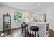 Kitchen island with breakfast bar and seating, offering views of the rest of the kitchen at 12674 Banbury Cir, Carmel, IN 46033