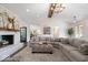 Spacious living room with fireplace, vaulted ceiling, and views of dining and kitchen at 12674 Banbury Cir, Carmel, IN 46033