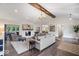 Bright living room with hardwood floors, vaulted ceiling, and a cozy fireplace at 12674 Banbury Cir, Carmel, IN 46033