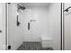 New, modern shower design with glass door, shower bench, and decorative floor tile at 12674 Banbury Cir, Carmel, IN 46033