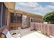 Rear patio featuring a partially fenced yard, brick exterior, and sunny view at 13 Marywood Dr, Greenfield, IN 46140