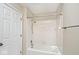 White tiled bathtub and shower combination that offers a clean and modern design at 13 Marywood Dr, Greenfield, IN 46140