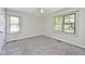 Bright and airy bedroom with neutral-colored walls and large windows, offering a comfortable retreat at 13 Marywood Dr, Greenfield, IN 46140